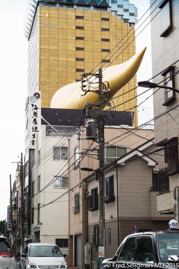 20150310_142754 D4S.jpg - Asahi Beer Hall, Tokyo.  The Asahi Flame was designed by Philippe Stark.  It is empty inside.